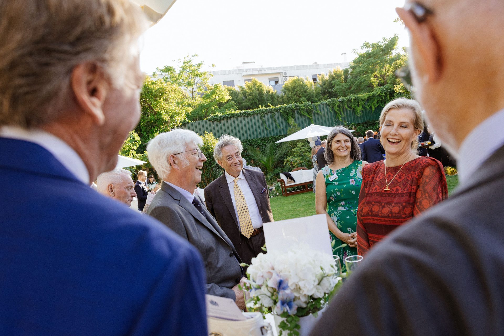 Guests enjoying a garden party at The British Retirement Home