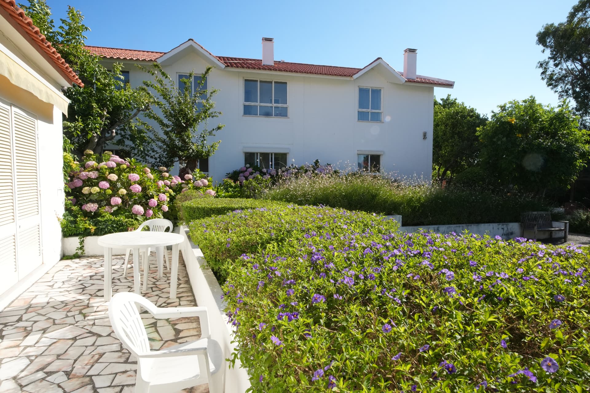 A sunny garden patio at The British Retirement Home